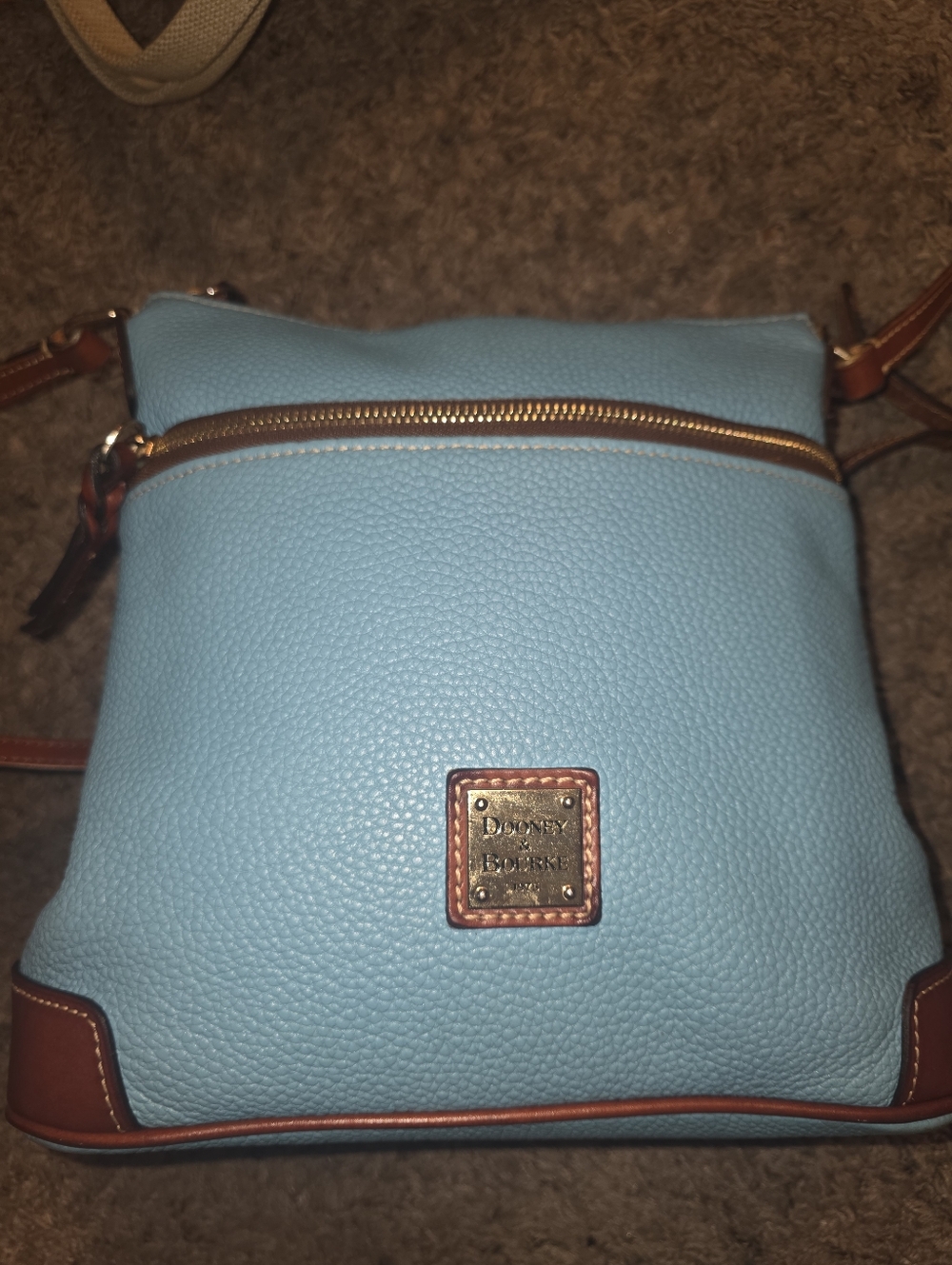 Dooney & Bourke Pebbled Leather Crossbody Bag in Light Blue. The Presclÿ
